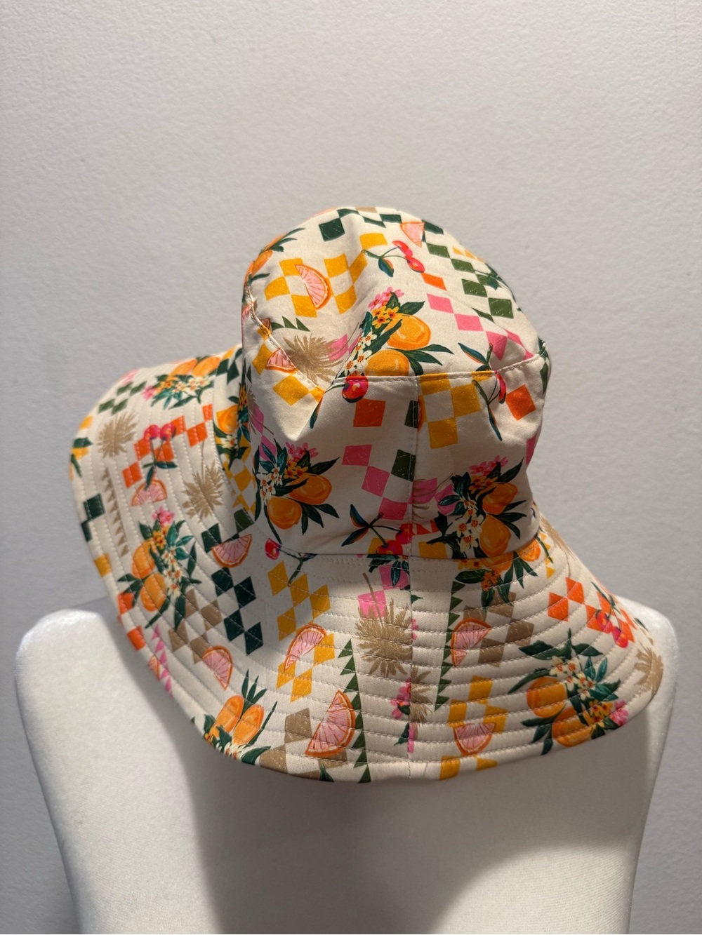 BCBGeneration Cream Bucket Hat with Orange & Pink Fruit Motif